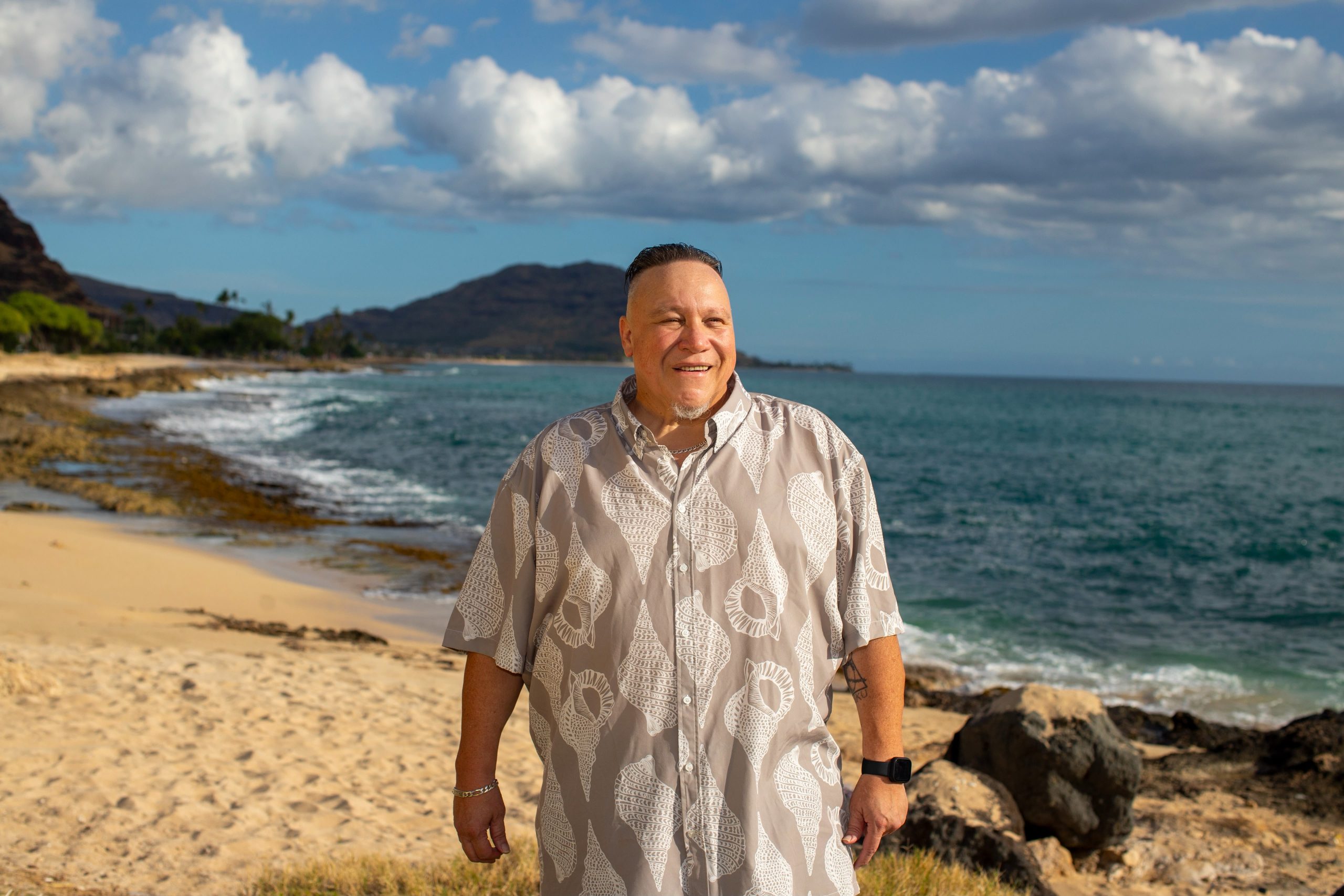 Jeff Rasmussen smiling beside the ocean